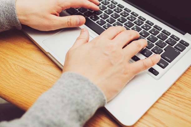 istock A man teleworking on his laptop at home. 1352360871