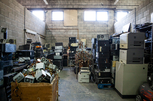 Recycling plant storage full of obsolete computer electronics equipment