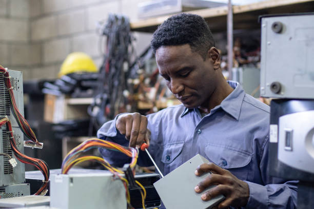 istock African american male e-waste recycling worker disarming computer components 1352363845