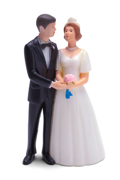 istock Bride and Groom Wedding Cake Topper 1352363862