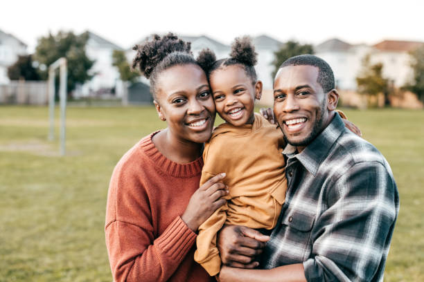 istock Cute baby and two parents 1352363897