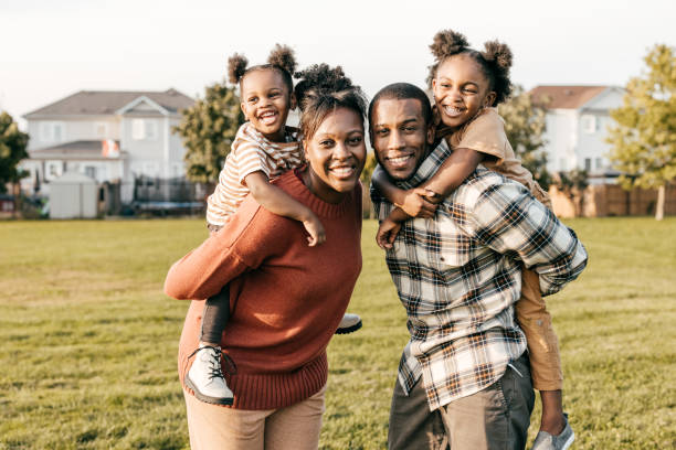 istock Happy kids and smiling parents 1352363906