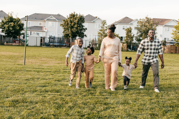 istock Family  with three kids  walking outside 1352363913