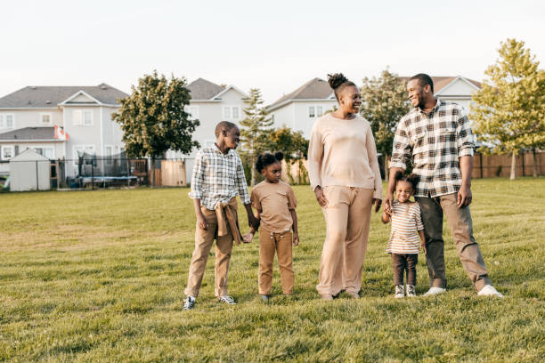 istock Family with three kids  outside 1352363915