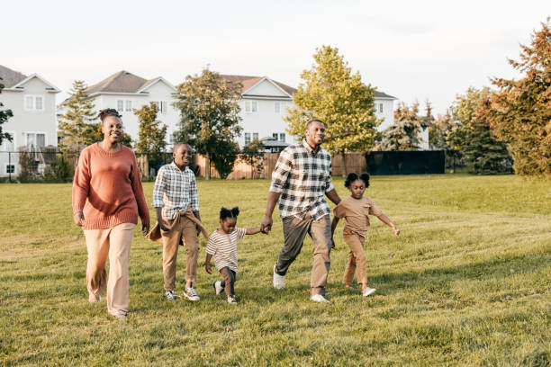 istock Happy family running outside and having fun 1352363922