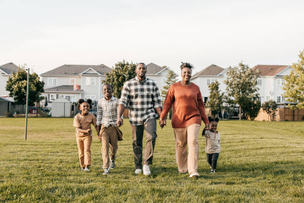 istock Family walking on the grass 1352363940