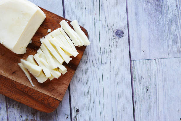 istock close up of fresh cheese on a chopping board on table 1352367904