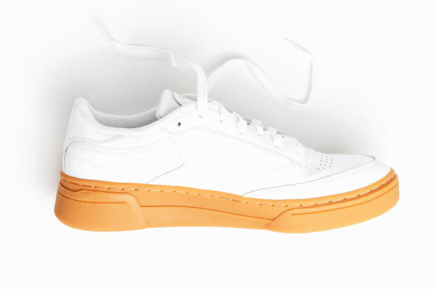 istock White male sneaker on white background close-up top view. 1352367928