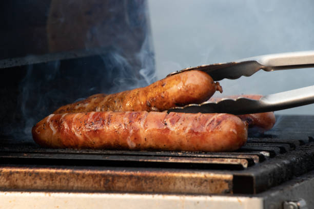 istock Barbequing sausages on the grill 1352370666