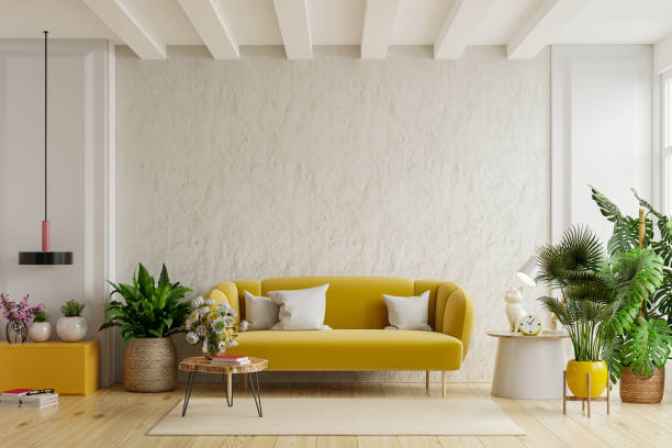 istock White wall living room with cozy luxury yellow sofa. 1352373109