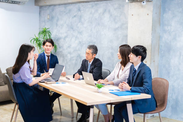 istock Business persons having a meeting in the office 1352375017