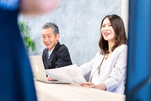 istock Business persons having a meeting in the office 1352375029