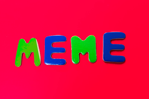 MEME: Word Written in Toy Letters, Vibrant Red Background