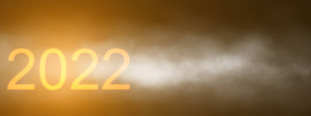 istock 2022 Golden and black glow new year background include light dark cloud smoke steamer and glitter 1352377806