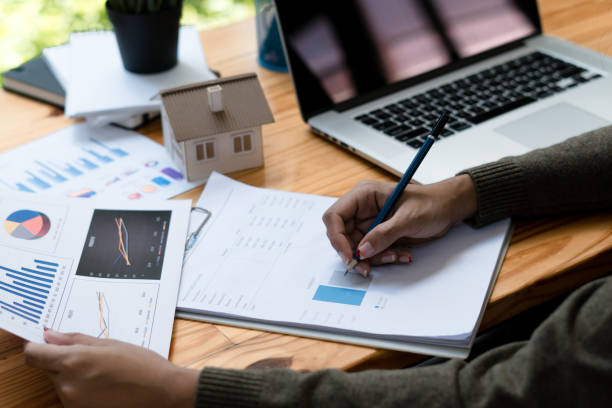 istock Businesswoman checking document report at co-working place. 1352379072