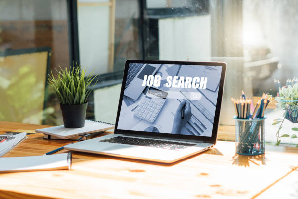laptop with job search engine on screen in modern office.