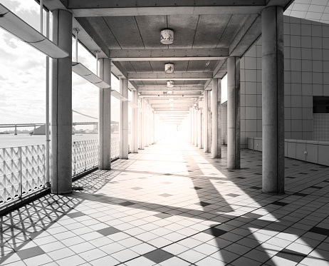 Backlit empty corridor with sunlight.