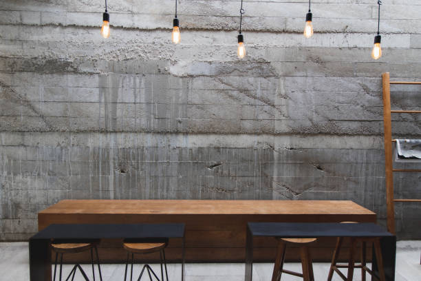 istock Layout in a loft style in dark colors open space interior view of various coffee Welcome open coffee shop background 1352391891