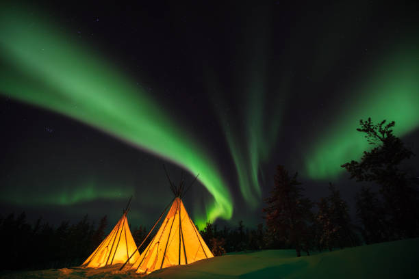 The aurora, glowing over Yellowknife city. It's like a goddess painting in the sky. great slave lake stock pictures, royalty-free photos & images
