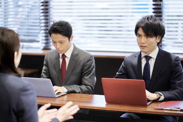 istock Asian managerial business person interviewing 1352394492