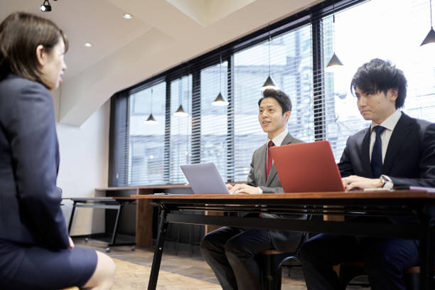 istock Asian managerial business person interviewing 1352396512