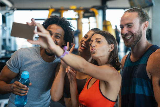 istock Friends making selfie in the gym after workout 1352399827