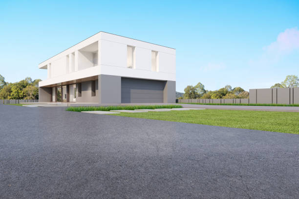 istock 3d rendering of modern house with garage and empty concrete road. 1352400807