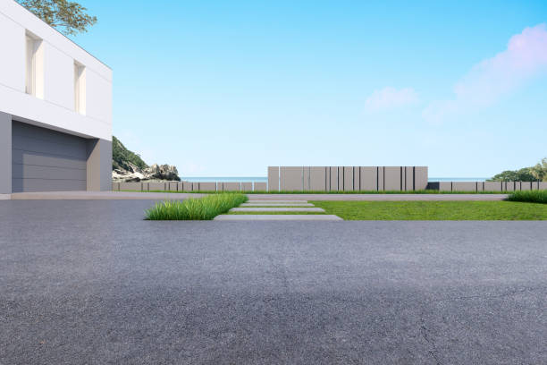 istock Empty concrete road with garage building and landscape on sea background. 3d rendering. 1352400809