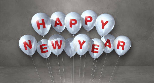 istock White happy new year balloons on a grey concrete background. Horizontal banner 1352401127