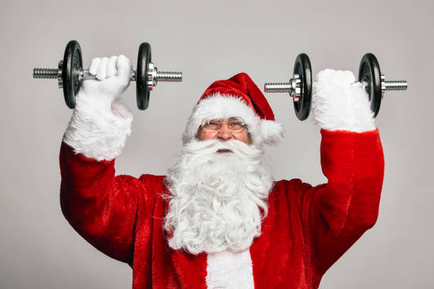 istock Santa Claus with large dumbbells 1352403042