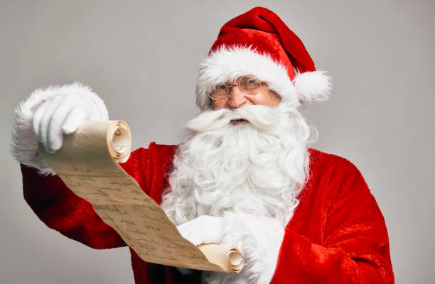 istock Santa Claus reading latter from kids 1352403160