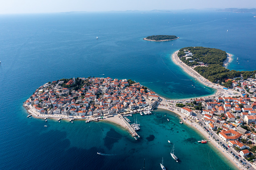 Drone point of view of the typical town on a peninsula on a summer day