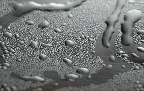 istock Macro background with water droplets condensation pattern on metal surface 1352404222