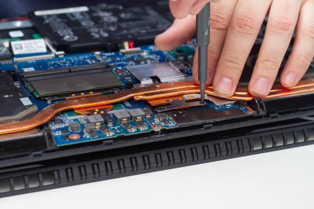 istock Disassemble the laptop for repair, chips, processor and boards inside the computer 1352404994