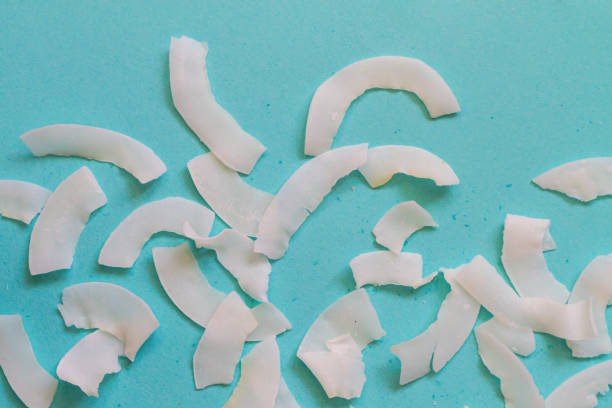 istock Background of dried coconut white chips on a blue background 1352406478