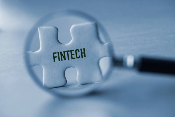 Fintech Magnifying glass and puzzle piece. Financial technology. financial technology stock pictures, royalty-free photos & images