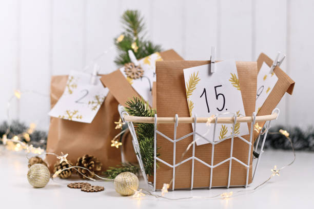 Advent Calendar Advent calendar made from homemade craft paper bags with handwritten numbers advent calendar stock pictures, royalty-free photos & images