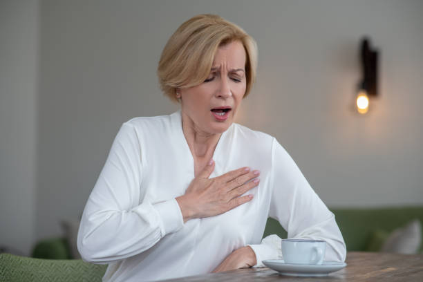istock Blonde woman having a heartattcak 1352410304