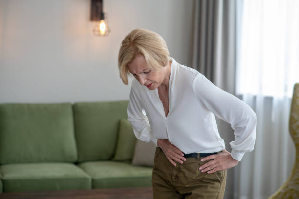 istock Blond woman feeling bad while suffering from a stomachache 1352410309