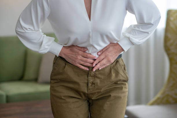 istock Blond woman feeling bad while suffering from a stomachache 1352410315