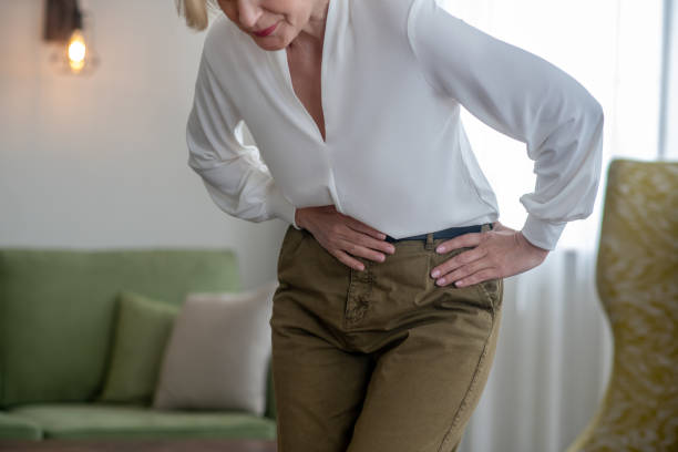 istock Blond woman feeling bad while suffering from a stomachache 1352410319