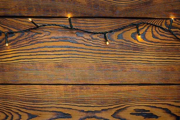 istock glowing garland on wooden background 1352410356