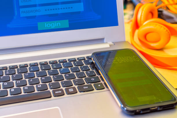 istock Internet payment concept of online banking using a laptop and a smartphone. 1352410532