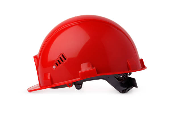 istock Red plastic safety hardhat isolated on white background 1352412034