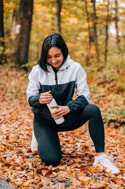 istock Young woman posing for a portrait outdoors in the forest 1352415622