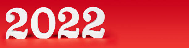 istock Happy New Year Christmas 2022. Red long rectangular banner with white wooden numbers 2022. Copy space. Place for text 1352416529