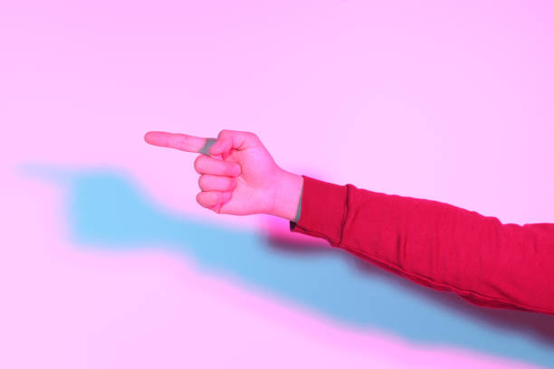 The Asian man hand in the gel color light Photography.