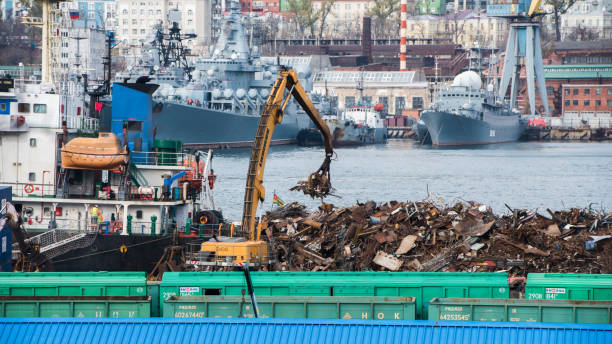 Loading of scrap of black metal in the port of Vladivostok. stock photo