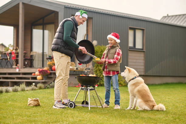 A family preparing christmas dinner and looking involved stock photo