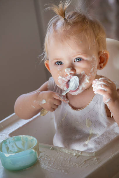 istock Girl eating cottage cheese 1352419060